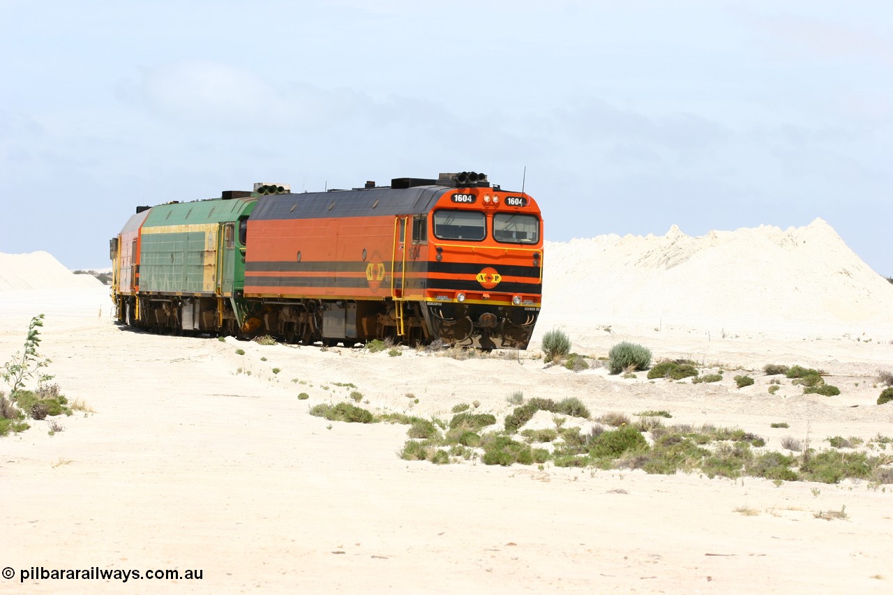 060113 2511
Kevin, empty train 6DD3 shunts back onto the triangle leg behind triple NJ/1600 class units, Clyde Engineering built EMD JL22C models, originally coded the NJ class and built for the Central Australia Railway in 1971, transferred to the Eyre Peninsula in 1981 and recoded to the 1600 class. 13th January 2006.
Keywords: 1600-class;1604;71-731;Clyde-Engineering-Granville-NSW;EMD;JL22C;NJ-class;NJ4;