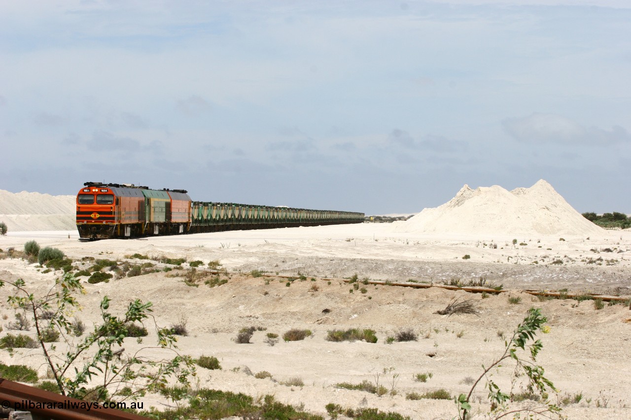 060113 2519
Kevin, empty train 6DD3 is on the west leg of the triangle as it prepares to pull forward and head south towards original gypsum loading siding to continue the reversing process. 13th January 2006.
Keywords: 1600-class;1604;71-731;Clyde-Engineering-Granville-NSW;EMD;JL22C;NJ-class;NJ4;