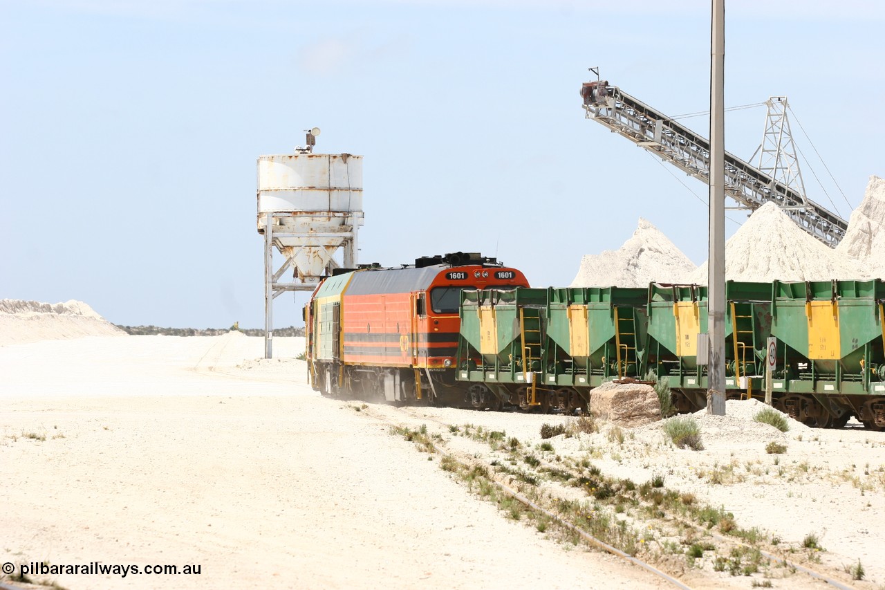 060113 2530
Kevin, empty train 6DD3 is heading onto the south leg with some of the gypsum plant behind the train and a set of original loading bins gypsum loading siding to continue the reversing process. 13th January 2006.
Keywords: 1600-class;1601;Clyde-Engineering-Granville-NSW;EMD;JL22C;71-728;NJ-class;NJ1;