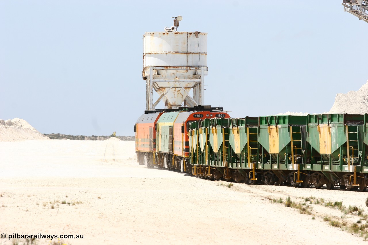 060113 2531
Kevin, empty train 6DD3 is heading onto the south leg with some of the gypsum plant behind the train and a set of original loading bins gypsum loading siding to continue the reversing process. 13th January 2006.
