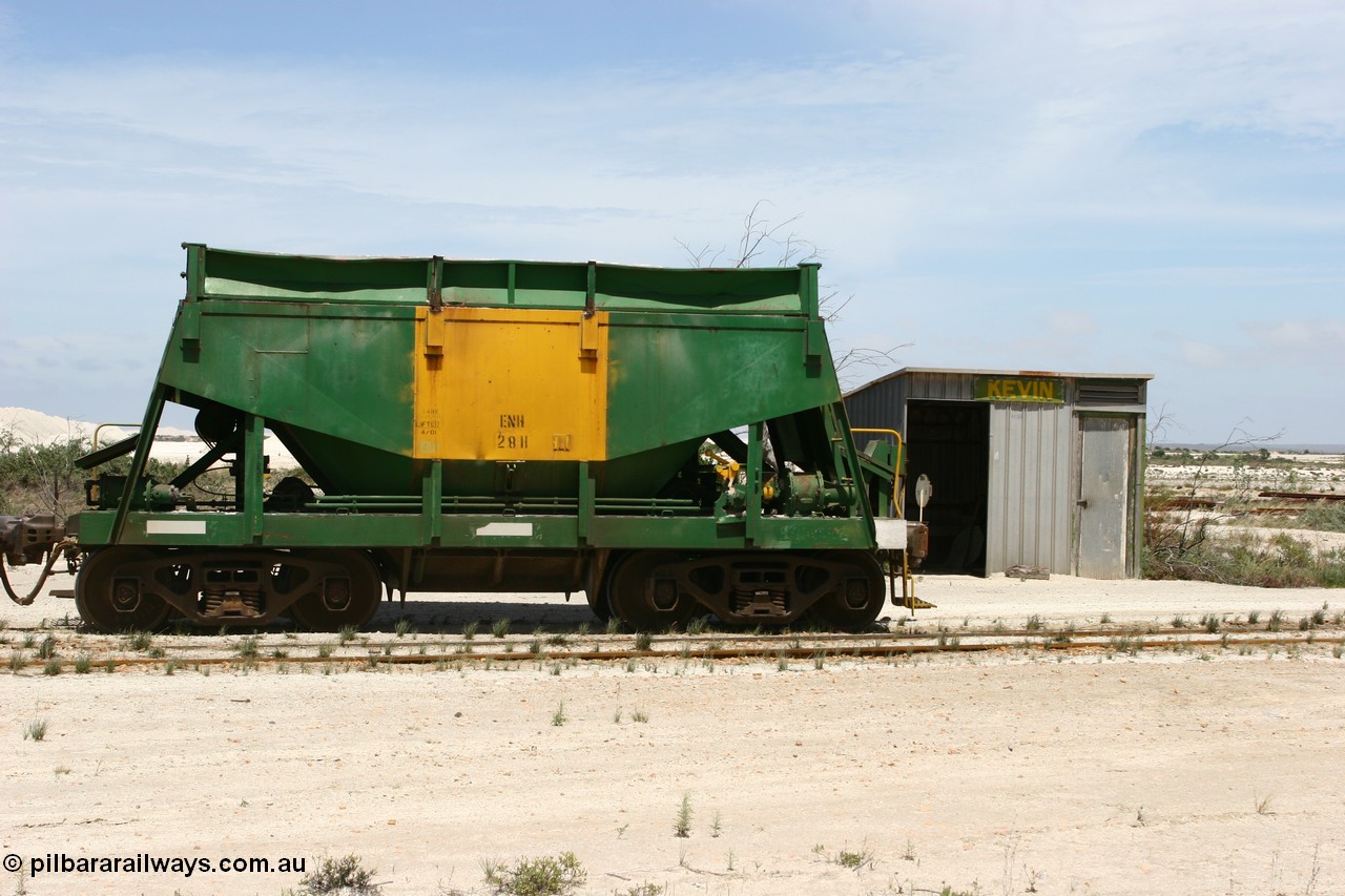 060113 2535
Kevin, originally an Kinki Sharyo built NH type for the NAR now coded ENH type ENH 28, is the last car of an empty train as it shunts back along the Penong line past the station building, [url=https://goo.gl/maps/JyRQW]Mallee shelter - train control cabin[/url], as the train is reversed prior to loading on the mainline to Thevenard. 13th January 2006.
Keywords: ENH-type;ENH28;Kinki-Sharyo-Japan;NH-type;NH928;