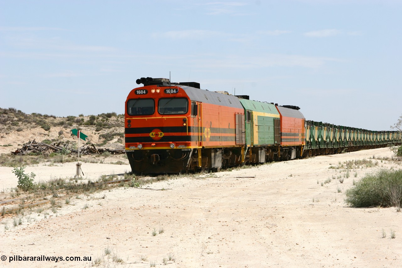 060113 2542
Kevin, with the points now set again for the mainline narrow gauge locos 1604, NJ 3 and 1601 sit on the mainline to Penong, having reversed train 6DD3 on the Kevin triangle 1600 class unit 1604 in Australian Railroad Group livery a Clyde Engineering built EMD JL22C model serial 71-731, originally built as NJ class NJ 4 and built for the Central Australia Railway in 1971, transferred to the Eyre Peninsula in 1981. 13th January 2006.
Keywords: 1600-class;1604;71-731;Clyde-Engineering-Granville-NSW;EMD;JL22C;NJ-class;NJ4;