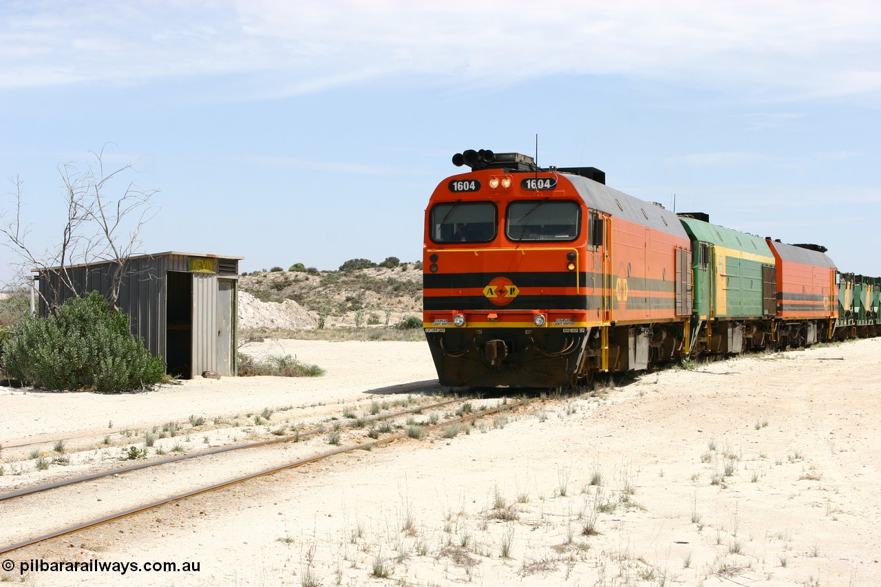 060113 2543
Kevin, narrow gauge locos 1604, NJ 3 and 1601 take the mainline to Thevenard, having reversed train 6DD3 on the Kevin triangle as they prepare to load, 1600 class unit 1604 in Australian Railroad Group livery a Clyde Engineering built EMD JL22C model serial 71-731, originally built as NJ class NJ 4 and built for the Central Australia Railway in 1971, transferred to the Eyre Peninsula in 1981. 13th January 2006.
Keywords: 1600-class;1604;71-731;Clyde-Engineering-Granville-NSW;EMD;JL22C;NJ-class;NJ4;