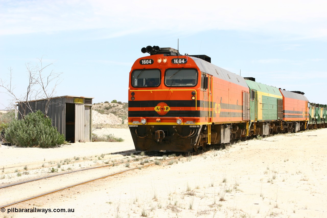 060113 2545
Kevin, narrow gauge locos 1604, NJ 3 and 1601 take the mainline to Thevenard, having reversed train 6DD3 on the Kevin triangle as they prepare to load, 1600 class unit 1604 in Australian Railroad Group livery a Clyde Engineering built EMD JL22C model serial 71-731, originally built as NJ class NJ 4 and built for the Central Australia Railway in 1971, transferred to the Eyre Peninsula in 1981. 13th January 2006.
Keywords: 1600-class;1604;71-731;Clyde-Engineering-Granville-NSW;EMD;JL22C;NJ-class;NJ4;