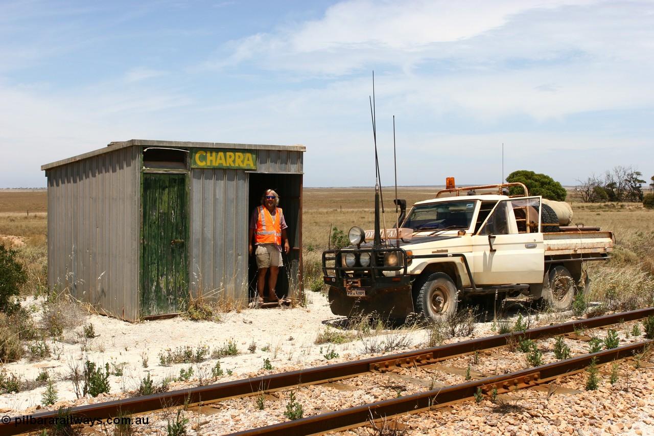 060113 2555
Charra at the 466.2 km, Pope Searle checks out the [url=https://goo.gl/maps/GpLTsHYeUymGtK5f7]Mallee style shelter building[/url]. Opened with the line on 13th February 1966 as a goods siding, reclassified as passing siding and extended, new goods loop siding constructed May 1982. 13th January 2006.
