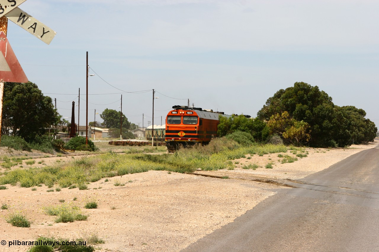 060113 2558
Thevenard, loaded gypsum train 6DD4 snakes into the yard behind 1600 class unit 1604 in Australian Railroad Group livery a Clyde Engineering built EMD JL22C model serial 71-731, originally built as NJ class NJ 4. [url=https://goo.gl/maps/9g3QoE4iaiDjqyta9]Bergmann Dr grade crossing[/url]. 13th January 2006.
Keywords: 1600-class;1604;71-731;Clyde-Engineering-Granville-NSW;EMD;JL22C;NJ-class;NJ4;