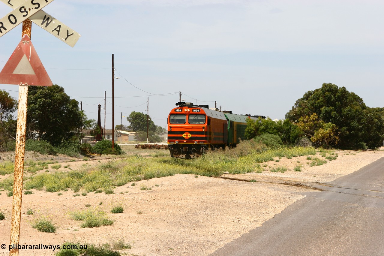 060113 2560
Thevenard, loaded gypsum train 6DD4 snakes into the yard behind 1600 class unit 1604 in Australian Railroad Group livery a Clyde Engineering built EMD JL22C model serial 71-731, originally built as NJ class NJ 4. [url=https://goo.gl/maps/9g3QoE4iaiDjqyta9]Bergmann Dr grade crossing[/url]. 13th January 2006.
Keywords: 1600-class;1604;71-731;Clyde-Engineering-Granville-NSW;EMD;JL22C;NJ-class;NJ4;