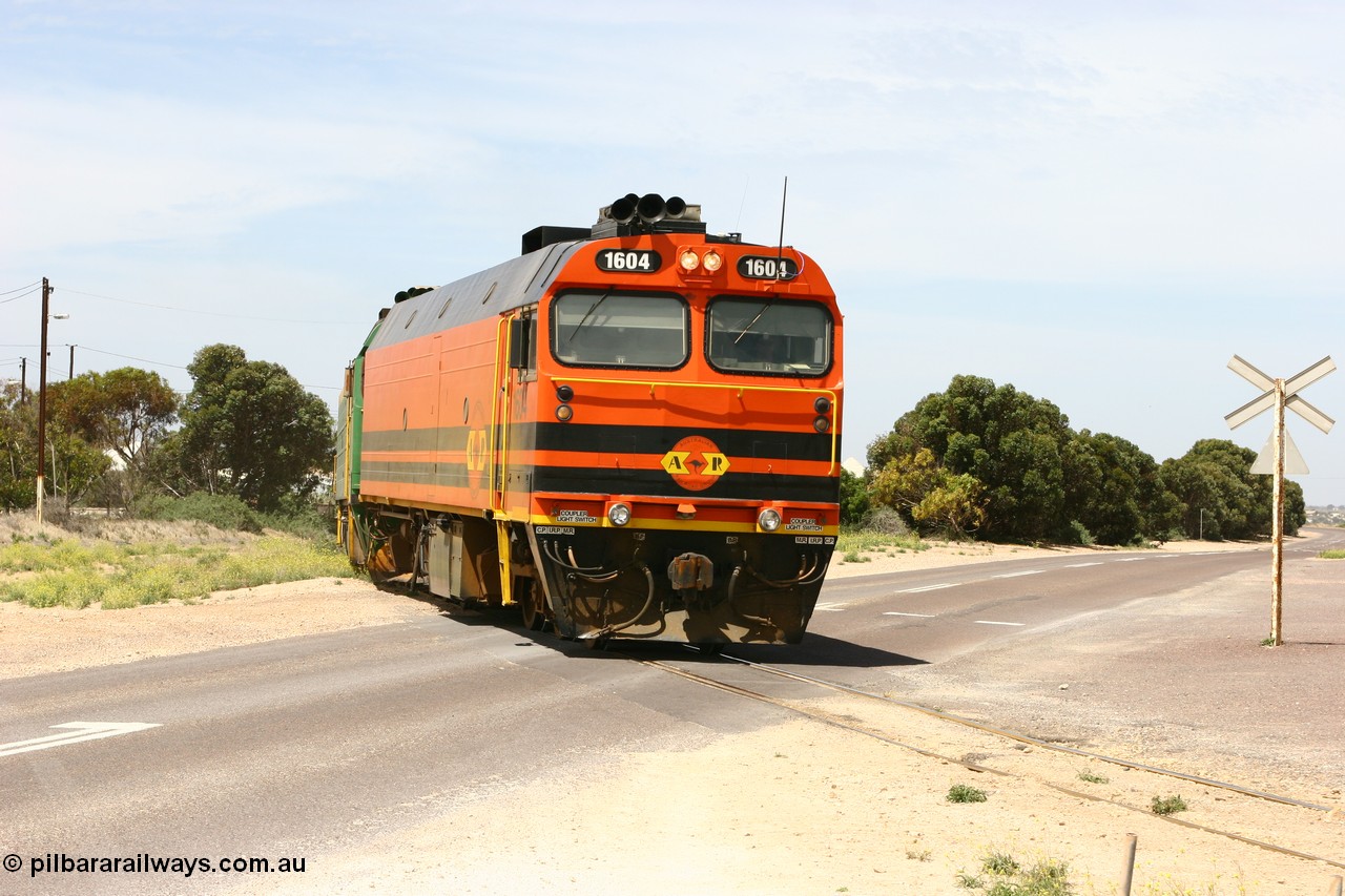 060113 2564
Thevenard, loaded gypsum train 6DD4 snakes through the yard and crosses Bergmann Drive behind 1600 class unit 1604 in Australian Railroad Group livery a Clyde Engineering built EMD JL22C model serial 71-731, originally built as NJ class NJ 4. [url=https://goo.gl/maps/9g3QoE4iaiDjqyta9]Bergmann Dr grade crossing[/url]. 13th January 2006.
Keywords: 1600-class;1604;Clyde-Engineering-Granville-NSW;EMD;JL22C;71-731;NJ-class;NJ4;