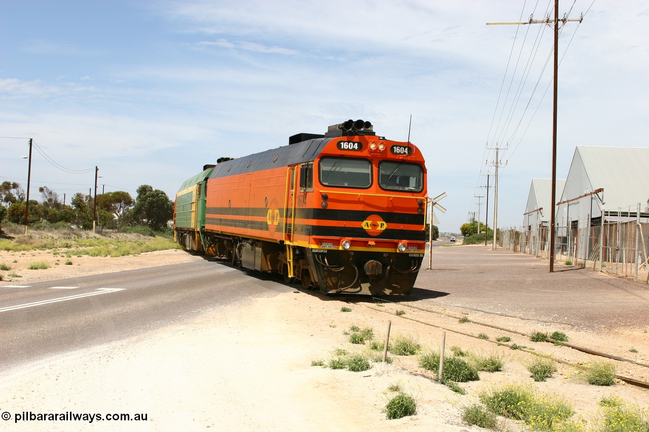 060113 2565
Thevenard, loaded gypsum train 6DD4 snakes through the yard and crosses Bergmann Drive behind 1600 class unit 1604 in Australian Railroad Group livery a Clyde Engineering built EMD JL22C model serial 71-731, originally built as NJ class NJ 4. [url=https://goo.gl/maps/9g3QoE4iaiDjqyta9]Bergmann Dr grade crossing[/url]. 13th January 2006.
Keywords: 1600-class;1604;Clyde-Engineering-Granville-NSW;EMD;JL22C;71-731;NJ-class;NJ4;