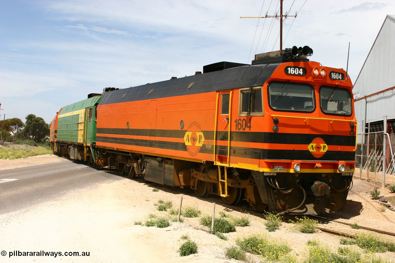 060113 2566
Thevenard, loaded gypsum train 6DD4 snakes through the yard and crosses Bergmann Drive behind 1600 class unit 1604 in Australian Railroad Group livery a Clyde Engineering built EMD JL22C model serial 71-731, originally built as NJ class NJ 4. [url=https://goo.gl/maps/9g3QoE4iaiDjqyta9]Bergmann Dr grade crossing[/url]. 13th January 2006.
Keywords: 1600-class;1604;Clyde-Engineering-Granville-NSW;EMD;JL22C;71-731;NJ-class;NJ4;