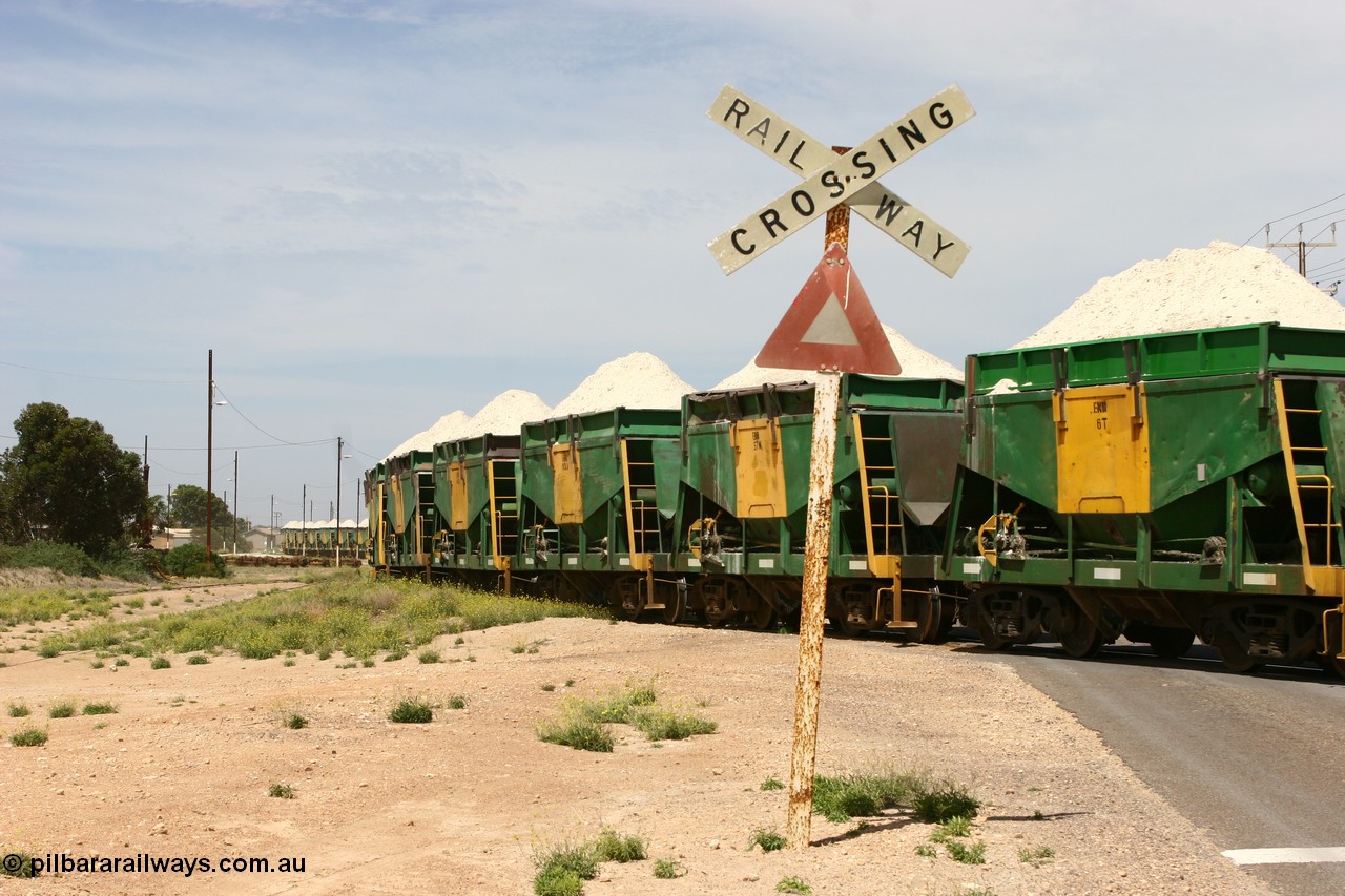 060113 2567
Thevenard, the string of ENH and ENHA waggons loaded high with gypsum on train 6DD4 as the snake through the yard destined for the unloader. [url=https://goo.gl/maps/9g3QoE4iaiDjqyta9]Bergmann Dr grade crossing[/url]. 13th January 2006.
Keywords: ENH-type;ENH6;Kinki-Sharyo-Japan;NH-type;NH906;