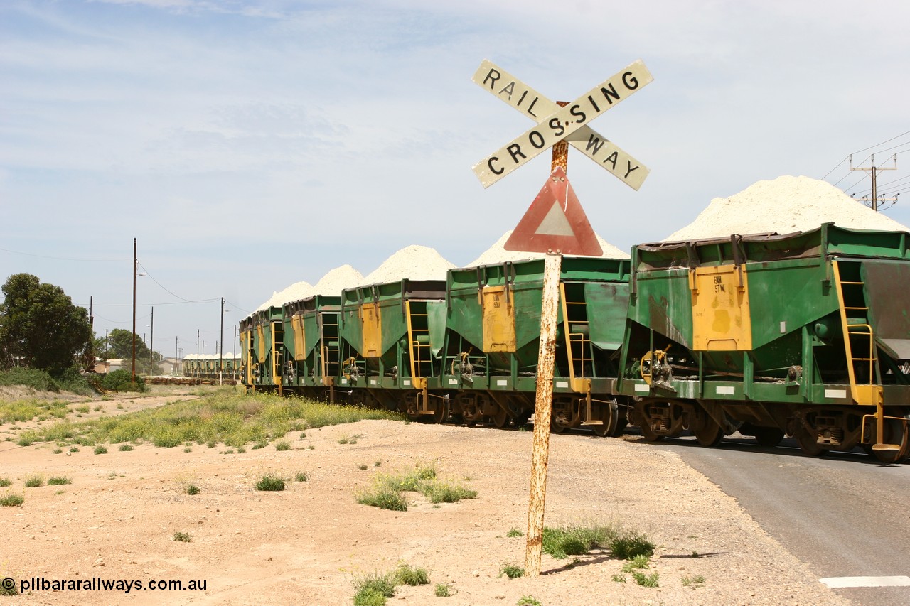 060113 2568
Thevenard, the string of ENH and ENHA waggons loaded high with gypsum on train 6DD4 as the snake through the yard destined for the unloader. [url=https://goo.gl/maps/9g3QoE4iaiDjqyta9]Bergmann Dr grade crossing[/url]. 13th January 2006.
Keywords: ENH-type;ENH57;Kinki-Sharyo-Japan;NH-type;NH957;