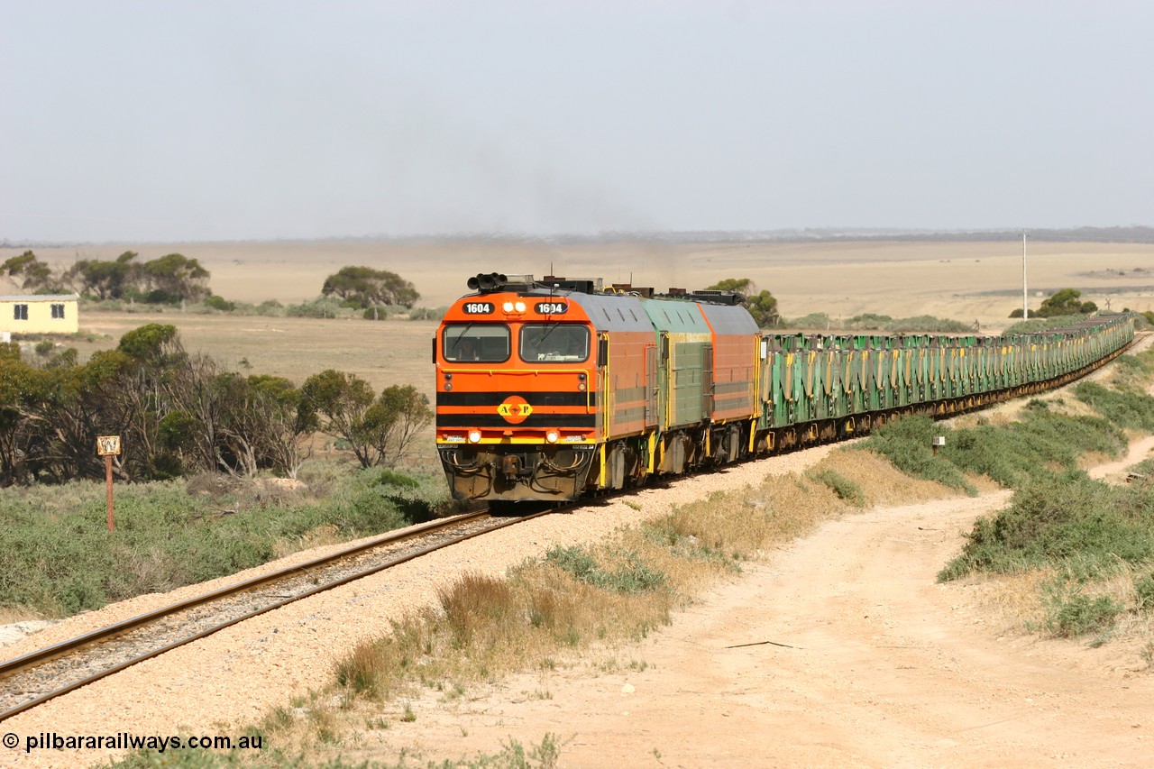 060113 2579
Ceduna, or Denial Bay area, empty gypsum train 6DD5 blasts up hill at the 440 km, west of Carpenter Corner Rd with power from triple 1600/NJ class units 1604, NJ 3 and 1601. 1604 in Australian Railroad Group livery is a Clyde Engineering built EMD JL22C model serial 71-731, originally built as NJ class NJ 4. [url=https://goo.gl/maps/ULA2PjjKh6nhwHTdA]Location approximation[/url]. 13th January 2006.
Keywords: 1600-class;1604;71-731;Clyde-Engineering-Granville-NSW;EMD;JL22C;NJ-class;NJ4;