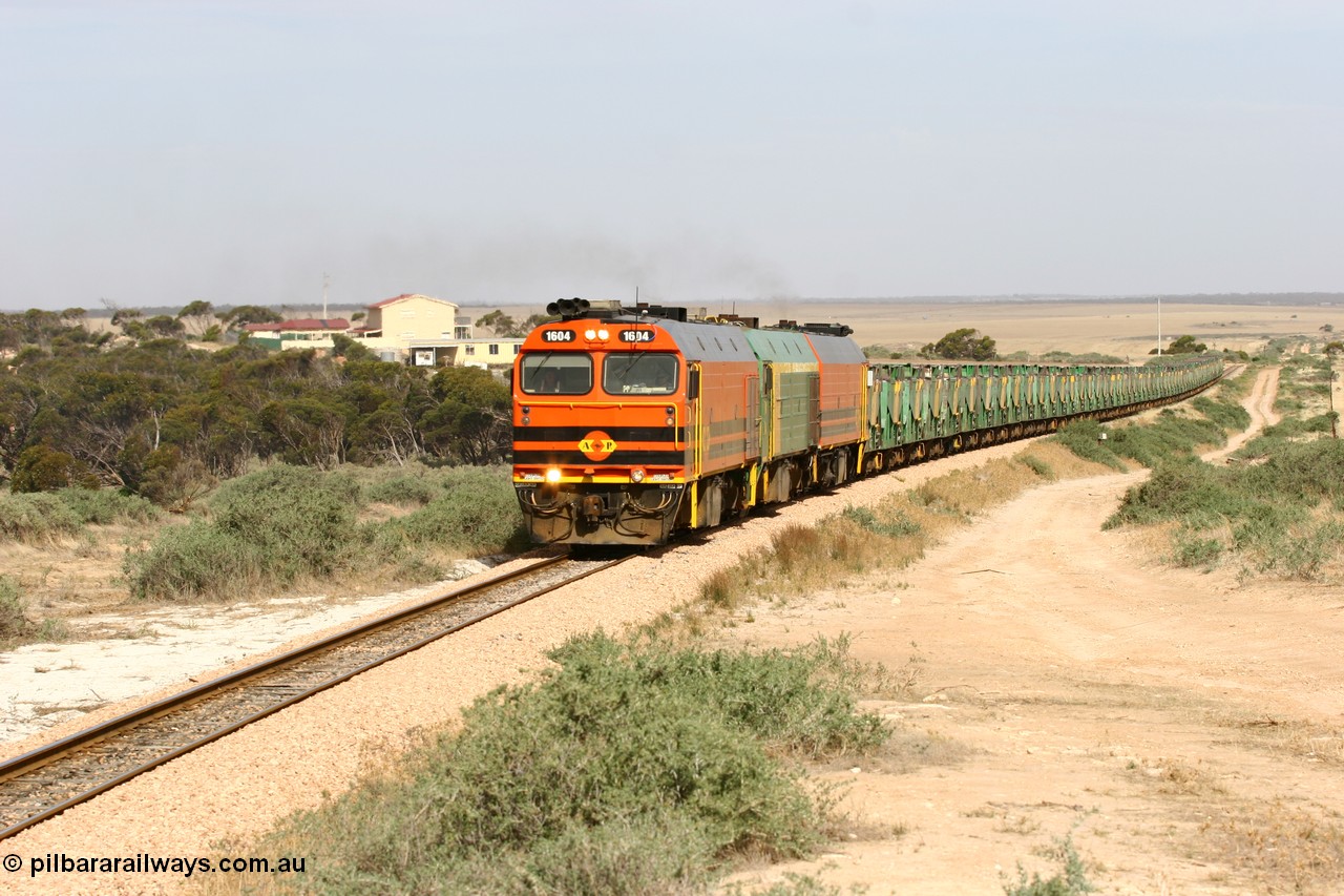 060113 2581
Ceduna, or Denial Bay area, empty gypsum train 6DD5 blasts up hill at the 440 km, west of Carpenter Corner Rd with power from triple 1600/NJ class units 1604, NJ 3 and 1601. 1604 in Australian Railroad Group livery is a Clyde Engineering built EMD JL22C model serial 71-731, originally built as NJ class NJ 4. [url=https://goo.gl/maps/ULA2PjjKh6nhwHTdA]Location approximation[/url]. 13th January 2006.
Keywords: 1600-class;1604;71-731;Clyde-Engineering-Granville-NSW;EMD;JL22C;NJ-class;NJ4;