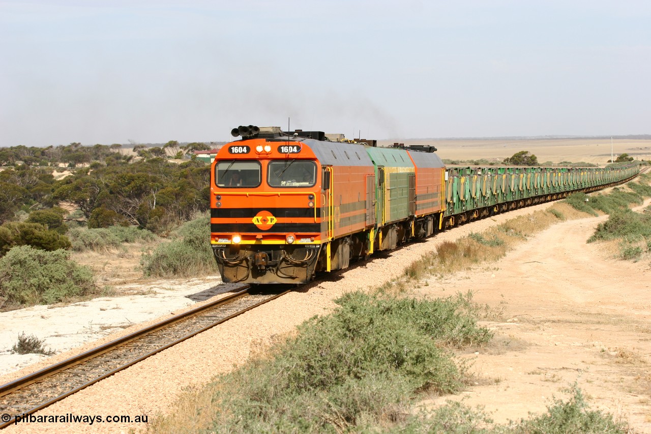 060113 2583
Ceduna, or Denial Bay area, empty gypsum train 6DD5 blasts up hill at the 440 km, west of Carpenter Corner Rd with power from triple 1600/NJ class units 1604, NJ 3 and 1601. 1604 in Australian Railroad Group livery is a Clyde Engineering built EMD JL22C model serial 71-731, originally built as NJ class NJ 4. [url=https://goo.gl/maps/ULA2PjjKh6nhwHTdA]Location approximation[/url]. 13th January 2006.
Keywords: 1600-class;1604;71-731;Clyde-Engineering-Granville-NSW;EMD;JL22C;NJ-class;NJ4;