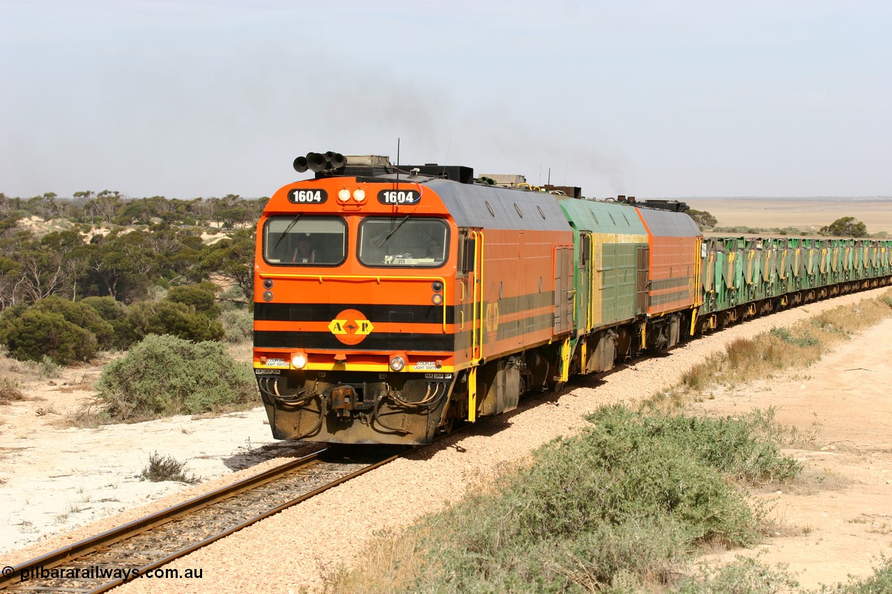 060113 2584
Ceduna, or Denial Bay area, empty gypsum train 6DD5 blasts up hill at the 440 km, west of Carpenter Corner Rd with power from triple 1600/NJ class units 1604, NJ 3 and 1601. 1604 in Australian Railroad Group livery is a Clyde Engineering built EMD JL22C model serial 71-731, originally built as NJ class NJ 4. [url=https://goo.gl/maps/ULA2PjjKh6nhwHTdA]Location approximation[/url]. 13th January 2006.
Keywords: 1600-class;1604;Clyde-Engineering-Granville-NSW;EMD;JL22C;71-731;NJ-class;NJ4;