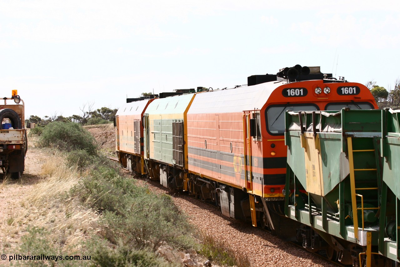 060113 2587
Ceduna, or Denial Bay area, empty gypsum train 6DD5 blasts up hill at the 440 km, west of Carpenter Corner Rd with power from triple 1600/NJ class units 1604, NJ 3 and 1601. 1601 in Australian Railroad Group livery is a Clyde Engineering built EMD JL22C model serial 71-728, originally built as NJ class NJ 1. [url=https://goo.gl/maps/ULA2PjjKh6nhwHTdA]Location approximation[/url]. 13th January 2006.
Keywords: 1600-class;1601;71-728;Clyde-Engineering-Granville-NSW;EMD;JL22C;NJ-class;NJ1;