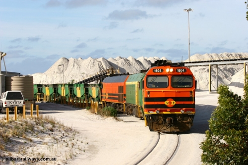 060113 2433
Thevenard, at the Gypsum Resources Australian (GRA) gypsum unloading site, 1604 leads a triple consist of Clyde Engineering EMD JL22C model 1600 / NJ class combination of 1604 serial 71-731 and originally NJ 4, NJ 3 serial 71-730 and 1601 serial 71-728 class leader NJ 1, all three units started on the Central Australia Railway in 1971 and were transferred to the Eyre Peninsula in 1981. 1604 and 1601 both renumbered in 2004. Friday January 13, 2006.
Keywords: 1600-class;1604;Clyde-Engineering-Granville-NSW;EMD;JL22C;71-731;NJ-class;NJ4;