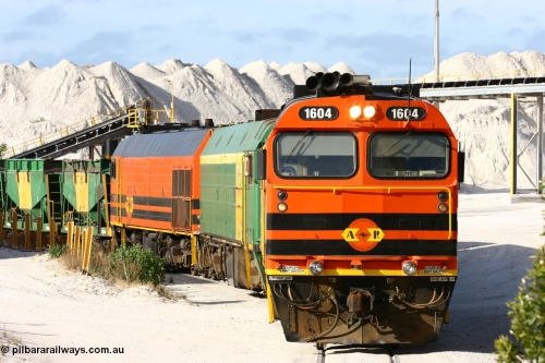 060113 2434
Thevenard, at the Gypsum Resources Australian (GRA) gypsum unloading site, 1604 leads a triple consist of Clyde Engineering EMD JL22C model 1600 / NJ class combination of 1604 serial 71-731 and originally NJ 4, NJ 3 serial 71-730 and 1601 serial 71-728 class leader NJ 1, all three units started on the Central Australia Railway in 1971 and were transferred to the Eyre Peninsula in 1981. 1604 and 1601 both renumbered in 2004. Friday January 13, 2006.
Keywords: 1600-class;1604;Clyde-Engineering-Granville-NSW;EMD;JL22C;71-731;NJ-class;NJ4;