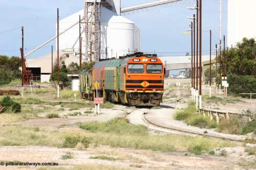 060113 2463
Thevenard, narrow gauge loco 1604 with a fresh crew depart the yard with empty train 6DD3, 1604 leads a triple consist of Clyde Engineering built EMD JL22C model 1600 / NJ class combination of 1604 serial 71-731 and originally NJ 4, NJ 3 serial 71-730 and 1601 serial 71-728 the original class leader NJ 1, all three units started on the Central Australia Railway in 1971 and were transferred to the Eyre Peninsula in 1981. 1604 and 1601 both renumbered in 2004. January 13, 2006.
Keywords: 1600-class;1604;Clyde-Engineering-Granville-NSW;EMD;JL22C;71-731;NJ-class;NJ4;
