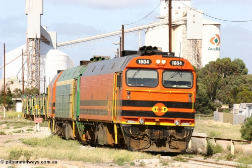 060113 2469
Thevenard, narrow gauge loco 1604 departs the yard with empty train 6DD3, 1604 leads a triple consist of Clyde Engineering built EMD JL22C model 1600 / NJ class combination of 1604 serial 71-731 and originally NJ 4, NJ 3 serial 71-730 and 1601 serial 71-728 the original class leader NJ 1, all three units started on the Central Australia Railway in 1971 and were transferred to the Eyre Peninsula in 1981. 1604 and 1601 both renumbered in 2004. January 13, 2006.
Keywords: 1600-class;1604;Clyde-Engineering-Granville-NSW;EMD;JL22C;71-731;NJ-class;NJ4;
