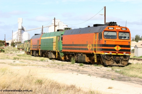 060113 2473
Thevenard, narrow gauge loco 1604 departs the yard with empty train 6DD3, 1604 leads a triple consist of Clyde Engineering built EMD JL22C model 1600 / NJ class combination of 1604 serial 71-731 and originally NJ 4, NJ 3 serial 71-730 and 1601 serial 71-728 the original class leader NJ 1, all three units started on the Central Australia Railway in 1971 and were transferred to the Eyre Peninsula in 1981. 1604 and 1601 both renumbered in 2004. January 13, 2006.
Keywords: 1600-class;1604;Clyde-Engineering-Granville-NSW;EMD;JL22C;71-731;NJ-class;NJ4;