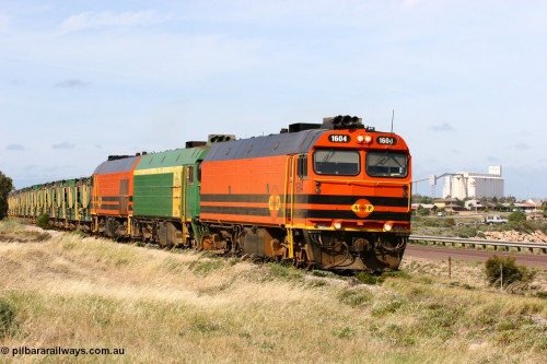 060113 2480
Thevenard, empty gypsum train 6DD3 lead by narrow gauge loco 1604 with a triple consist of Clyde Engineering built EMD JL22C model 1600 / NJ class combination of 1604 serial 71-731 and originally NJ 4, NJ 3 serial 71-730 and 1601 serial 71-728 the original class leader NJ 1, all three units started on the Central Australia Railway in 1971 and were transferred to the Eyre Peninsula in 1981. 1604 and 1601 both renumbered in 2004 [url=https://goo.gl/maps/3dLGGj7AFkE82J4A8]GeoData[/url]. January 13, 2006.
Keywords: 1600-class;1604;Clyde-Engineering-Granville-NSW;EMD;JL22C;71-731;NJ-class;NJ4;