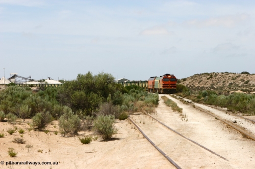 060113 2482
Thevenard, empty gypsum train 6DD3 lead by narrow gauge loco 1604 with a triple consist of Clyde Engineering built EMD JL22C model 1600 / NJ class combination of 1604 serial 71-731 and originally NJ 4, NJ 3 serial 71-730 and 1601 serial 71-728 the original class leader NJ 1, all three units started on the Central Australia Railway in 1971 and were transferred to the Eyre Peninsula in 1981. 1604 and 1601 both renumbered in 2004 [url=https://goo.gl/maps/3dLGGj7AFkE82J4A8]GeoData[/url]. January 13, 2006.
Keywords: 1600-class;1604;Clyde-Engineering-Granville-NSW;EMD;JL22C;71-731;NJ-class;NJ4;
