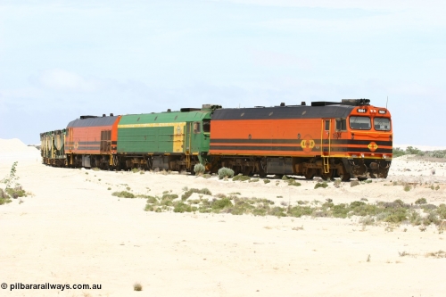 060113 2510
Kevin, empty train 6DD3 shunts back onto the triangle leg behind triple NJ/1600 class units, Clyde Engineering built EMD JL22C models, originally coded the NJ class and built for the Central Australia Railway in 1971, transferred to the Eyre Peninsula in 1981 and recoded to the 1600 class. January 13, 2006.
Keywords: 1600-class;1604;Clyde-Engineering-Granville-NSW;EMD;JL22C;71-731;NJ-class;NJ4;