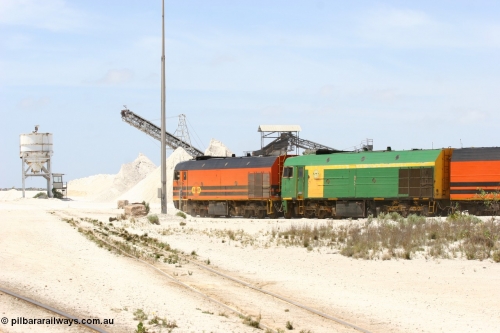 060113 2527
Kevin, empty train 6DD3 is heading onto the south leg with some of the gypsum plant behind the train and a set of original loading bins gypsum loading siding to continue the reversing process. January 13, 2006.
Keywords: NJ-class;NJ3;Clyde-Engineering-Granville-NSW;EMD;JL22C;71-730;