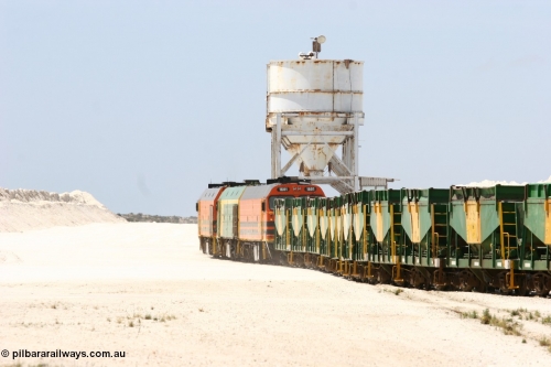 060113 2533
Kevin, empty train 6DD3 is heading onto the south leg with some of the gypsum plant behind the train and a set of original loading bins gypsum loading siding to continue the reversing process. January 13, 2006.
