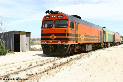 060113 2537
Kevin, 1600 class unit 1604 in Australian Railroad Group livery a Clyde Engineering built EMD JL22C model serial 71-731, originally built as NJ class NJ 4 and built for the Central Australia Railway in 1971, transferred to the Eyre Peninsula in 1981, shunts back along the Penong line past the station building, [url=https://goo.gl/maps/JyRQW]Mallee shelter - train control cabin[/url], as the train is reversed prior to loading on the mainline to Thevenard. January 13, 2006.
Keywords: 1600-class;1604;Clyde-Engineering-Granville-NSW;EMD;JL22C;71-731;NJ-class;NJ4;