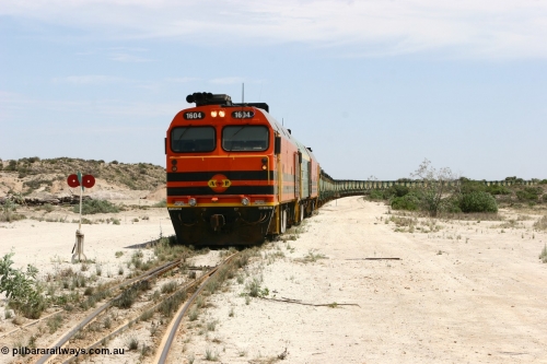 060113 2538
Kevin, 1600 class unit 1604 in Australian Railroad Group livery a Clyde Engineering built EMD JL22C model serial 71-731, originally built as NJ class NJ 4 and built for the Central Australia Railway in 1971, transferred to the Eyre Peninsula in 1981, shunts back along the Penong line with the points indicator set for the siding and the goods siding on the right of the train. [url=https://goo.gl/maps/JyRQW]Kevin station area[/url], as the train is reversed prior to loading on the mainline to Thevenard. January 13, 2006.
Keywords: 1600-class;1604;Clyde-Engineering-Granville-NSW;EMD;JL22C;71-731;NJ-class;NJ4;