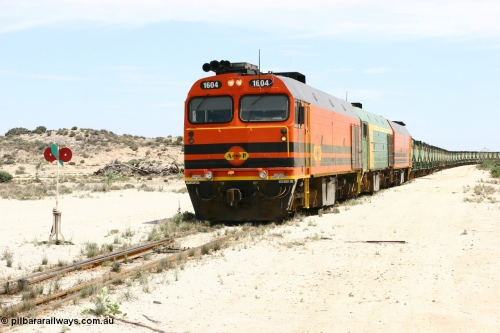060113 2540
Kevin, 1600 class unit 1604 in Australian Railroad Group livery a Clyde Engineering built EMD JL22C model serial 71-731, originally built as NJ class NJ 4 and built for the Central Australia Railway in 1971, transferred to the Eyre Peninsula in 1981, shunts back along the Penong line with the points indicator set for the siding and the goods siding on the right of the train. [url=https://goo.gl/maps/JyRQW]Kevin station area[/url], as the train is reversed prior to loading on the mainline to Thevenard. January 13, 2006.
Keywords: 1600-class;1604;Clyde-Engineering-Granville-NSW;EMD;JL22C;71-731;NJ-class;NJ4;