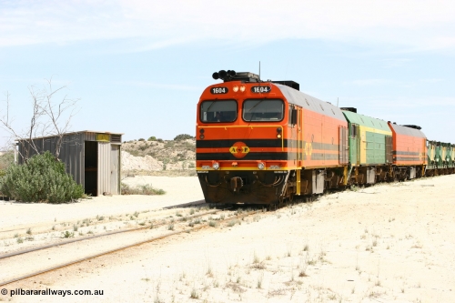060113 2544
Kevin, narrow gauge locos 1604, NJ 3 and 1601 take the mainline to Thevenard, having reversed train 6DD3 on the Kevin triangle as they prepare to load, 1600 class unit 1604 in Australian Railroad Group livery a Clyde Engineering built EMD JL22C model serial 71-731, originally built as NJ class NJ 4 and built for the Central Australia Railway in 1971, transferred to the Eyre Peninsula in 1981. January 13, 2006.
Keywords: 1600-class;1604;Clyde-Engineering-Granville-NSW;EMD;JL22C;71-731;NJ-class;NJ4;