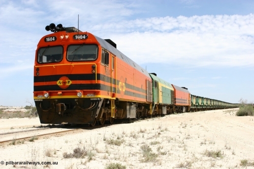060113 2547
Kevin, narrow gauge locos 1604, NJ 3 and 1601 take the mainline to Thevenard, having reversed train 6DD3 on the Kevin triangle as they prepare to load, 1600 class unit 1604 in Australian Railroad Group livery a Clyde Engineering built EMD JL22C model serial 71-731, originally built as NJ class NJ 4 and built for the Central Australia Railway in 1971, transferred to the Eyre Peninsula in 1981. January 13, 2006.
Keywords: 1600-class;1604;Clyde-Engineering-Granville-NSW;EMD;JL22C;71-731;NJ-class;NJ4;