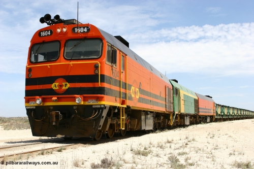 060113 2548
Kevin, narrow gauge locos 1604, NJ 3 and 1601 take the mainline to Thevenard, having reversed train 6DD3 on the Kevin triangle as they prepare to load, 1600 class unit 1604 in Australian Railroad Group livery a Clyde Engineering built EMD JL22C model serial 71-731, originally built as NJ class NJ 4 and built for the Central Australia Railway in 1971, transferred to the Eyre Peninsula in 1981. January 13, 2006.
Keywords: 1600-class;1604;Clyde-Engineering-Granville-NSW;EMD;JL22C;71-731;NJ-class;NJ4;