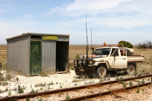 060113 2556
Charra at the 466.2 km, [url=https://goo.gl/maps/GpLTsHYeUymGtK5f7]Mallee style shelter building[/url]. Opened with the line on 13th February 1966 as a goods siding, reclassified as passing siding and extended, new goods loop siding constructed May 1982. January 13, 2006.
