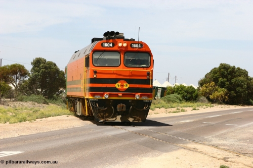060113 2563
Thevenard, loaded gypsum train 6DD4 snakes through the yard and crosses Bergmann Drive behind 1600 class unit 1604 in Australian Railroad Group livery a Clyde Engineering built EMD JL22C model serial 71-731, originally built as NJ class NJ 4. [url=https://goo.gl/maps/9g3QoE4iaiDjqyta9]Bergmann Dr grade crossing[/url]. January 13, 2006.
Keywords: 1600-class;1604;Clyde-Engineering-Granville-NSW;EMD;JL22C;71-731;NJ-class;NJ4;