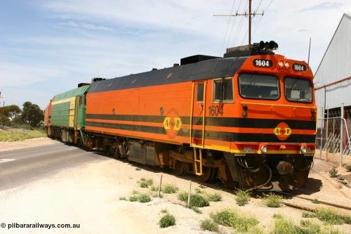 060113 2566
Thevenard, loaded gypsum train 6DD4 snakes through the yard and crosses Bergmann Drive behind 1600 class unit 1604 in Australian Railroad Group livery a Clyde Engineering built EMD JL22C model serial 71-731, originally built as NJ class NJ 4. [url=https://goo.gl/maps/9g3QoE4iaiDjqyta9]Bergmann Dr grade crossing[/url]. January 13, 2006.
Keywords: 1600-class;1604;Clyde-Engineering-Granville-NSW;EMD;JL22C;71-731;NJ-class;NJ4;