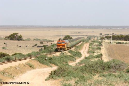 060113 2573
Ceduna, or Denial Bay area, empty gypsum train 6DD5 blasts up hill at the 440 km, crossing Carpenter Corner Rd with power from triple 1600/NJ class units 1604, NJ 3 and 1601. 1604 in Australian Railroad Group livery is a Clyde Engineering built EMD JL22C model serial 71-731, originally built as NJ class NJ 4. [url=https://goo.gl/maps/ULA2PjjKh6nhwHTdA]Location approximation[/url]. January 13, 2006.
Keywords: 1600-class;1604;Clyde-Engineering-Granville-NSW;EMD;JL22C;71-731;NJ-class;NJ4;