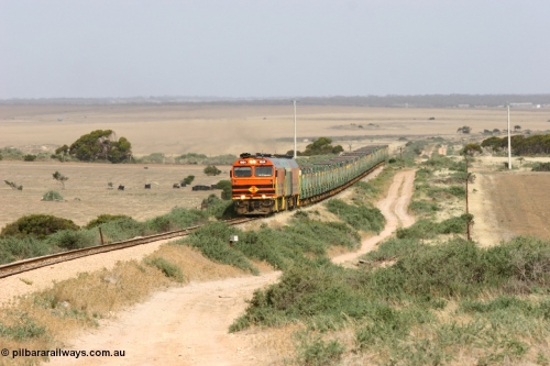 060113 2575
Ceduna, or Denial Bay area, empty gypsum train 6DD5 blasts up hill at the 440 km, crossing Carpenter Corner Rd with power from triple 1600/NJ class units 1604, NJ 3 and 1601. 1604 in Australian Railroad Group livery is a Clyde Engineering built EMD JL22C model serial 71-731, originally built as NJ class NJ 4. [url=https://goo.gl/maps/ULA2PjjKh6nhwHTdA]Location approximation[/url]. January 13, 2006.
Keywords: 1600-class;1604;Clyde-Engineering-Granville-NSW;EMD;JL22C;71-731;NJ-class;NJ4;
