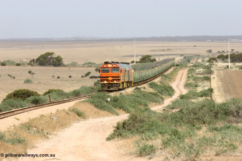 060113 2576
Ceduna, or Denial Bay area, empty gypsum train 6DD5 blasts up hill at the 440 km, west of Carpenter Corner Rd with power from triple 1600/NJ class units 1604, NJ 3 and 1601. 1604 in Australian Railroad Group livery is a Clyde Engineering built EMD JL22C model serial 71-731, originally built as NJ class NJ 4. [url=https://goo.gl/maps/ULA2PjjKh6nhwHTdA]Location approximation[/url]. January 13, 2006.
Keywords: 1600-class;1604;Clyde-Engineering-Granville-NSW;EMD;JL22C;71-731;NJ-class;NJ4;