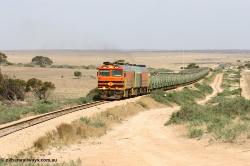 060113 2577
Ceduna, or Denial Bay area, empty gypsum train 6DD5 blasts up hill at the 440 km, west of Carpenter Corner Rd with power from triple 1600/NJ class units 1604, NJ 3 and 1601. 1604 in Australian Railroad Group livery is a Clyde Engineering built EMD JL22C model serial 71-731, originally built as NJ class NJ 4. [url=https://goo.gl/maps/ULA2PjjKh6nhwHTdA]Location approximation[/url]. January 13, 2006.
Keywords: 1600-class;1604;Clyde-Engineering-Granville-NSW;EMD;JL22C;71-731;NJ-class;NJ4;