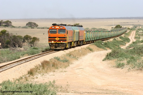 060113 2578
Ceduna, or Denial Bay area, empty gypsum train 6DD5 blasts up hill at the 440 km, west of Carpenter Corner Rd with power from triple 1600/NJ class units 1604, NJ 3 and 1601. 1604 in Australian Railroad Group livery is a Clyde Engineering built EMD JL22C model serial 71-731, originally built as NJ class NJ 4. [url=https://goo.gl/maps/ULA2PjjKh6nhwHTdA]Location approximation[/url]. January 13, 2006.
Keywords: 1600-class;1604;Clyde-Engineering-Granville-NSW;EMD;JL22C;71-731;NJ-class;NJ4;