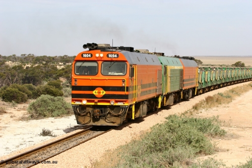 060113 2584
Ceduna, or Denial Bay area, empty gypsum train 6DD5 blasts up hill at the 440 km, west of Carpenter Corner Rd with power from triple 1600/NJ class units 1604, NJ 3 and 1601. 1604 in Australian Railroad Group livery is a Clyde Engineering built EMD JL22C model serial 71-731, originally built as NJ class NJ 4. [url=https://goo.gl/maps/ULA2PjjKh6nhwHTdA]Location approximation[/url]. January 13, 2006.
Keywords: 1600-class;1604;Clyde-Engineering-Granville-NSW;EMD;JL22C;71-731;NJ-class;NJ4;