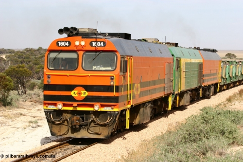 060113 2585
Ceduna, or Denial Bay area, empty gypsum train 6DD5 blasts up hill at the 440 km, west of Carpenter Corner Rd with power from triple 1600/NJ class units 1604, NJ 3 and 1601. 1604 in Australian Railroad Group livery is a Clyde Engineering built EMD JL22C model serial 71-731, originally built as NJ class NJ 4. [url=https://goo.gl/maps/ULA2PjjKh6nhwHTdA]Location approximation[/url]. January 13, 2006.
Keywords: 1600-class;1604;Clyde-Engineering-Granville-NSW;EMD;JL22C;71-731;NJ-class;NJ4;
