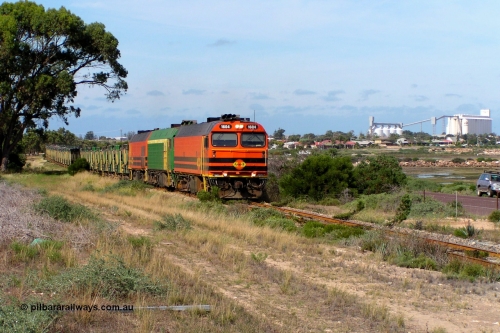 060113 P1010175
Thevenard, blasting away from town upgrade with the port in the distance, 1604 leads a triple consist of Clyde Engineering EMD JL22C model 1600 / NJ class combination of 1604 serial 71-731 and originally NJ 4, NJ 3 serial 71-730 and 1601 serial 71-728 class leader NJ 1, all three units started on the Central Australia Railway in 1971 and were transferred to the Eyre Peninsula in 1981. 1604 and 1601 both renumbered in 2004. Friday 13th January 2006. Pope Searle photo.
Keywords: 1600-class;1604;Clyde-Engineering-Granville-NSW;EMD;JL22C;71-731;NJ-class;NJ4;