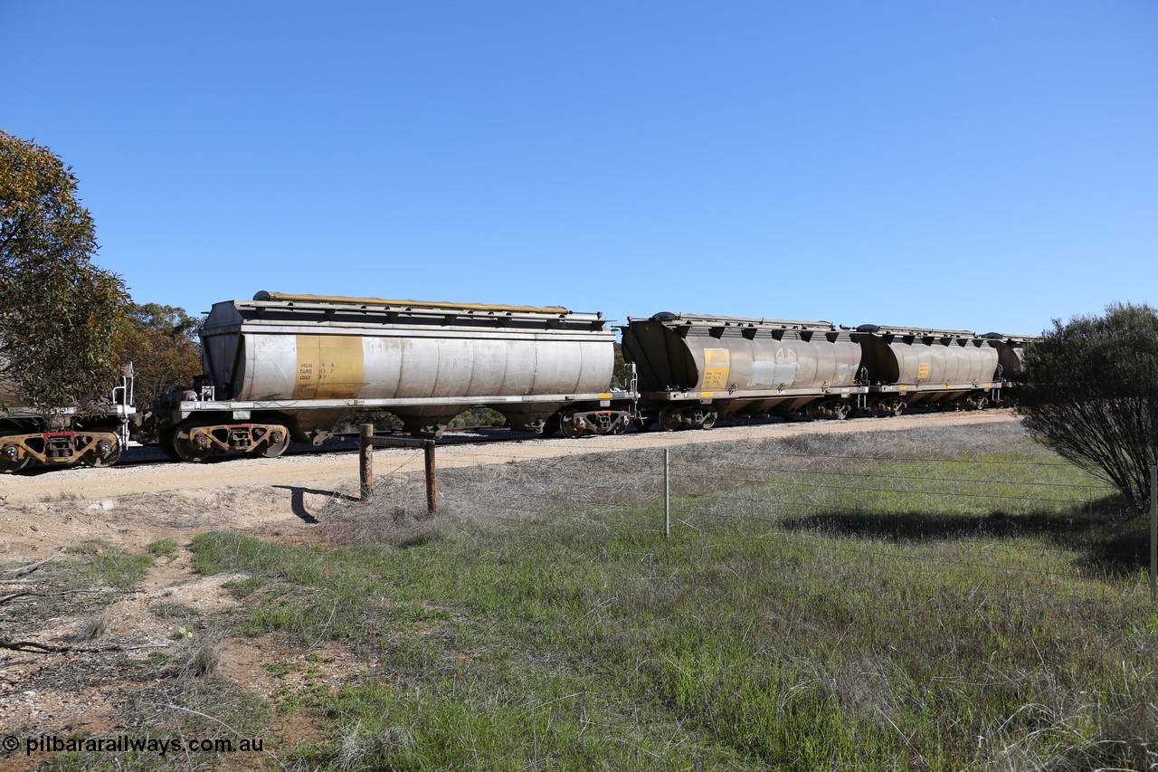 130703 0144
Murdinga, HCN 4 and HAN 27, HCN type bogie grain hopper waggon HCN 4, originally an NHB type hopper built by Tulloch Ltd for the Commonwealth Railways North Australia Railway. One of forty rebuilt by Islington Workshops 1978-79 to the HCN type with a 36 ton rating, increased to 40 tonnes in 1984. Seen here loaded with grain with a Moose Metalworks roll-top cover, HAN 27 is one of sixty eight waggons built by South Australian Railways Islington Workshops between 1969 and 1973 as the HAN type for the Eyre Peninsula system. 3rd July 2013.
Keywords: HCN-type;HCN4;SAR-Islington-WS;rebuild;Tulloch-Ltd-NSW;NHB-type;NHB1017;