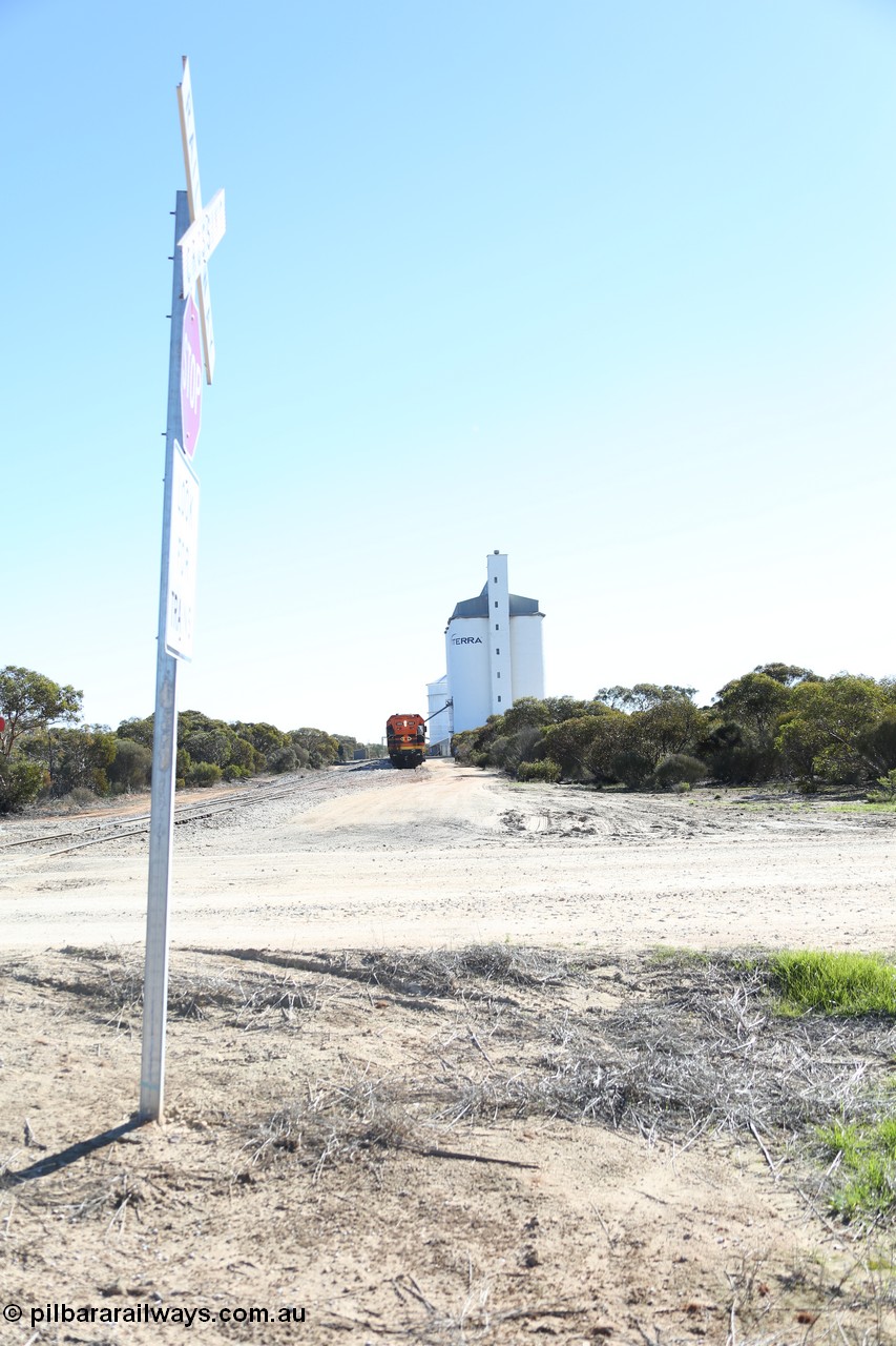 130703 0159
Murdinga, overview of the station yard looking north, Mallee style shelter train control building on the left, grain train loading on the siding, eight cell concrete grain silo complex with Ascom single cell behind it. [url=https://goo.gl/maps/LShPNnU33Qbmc1879]Geo location[/url]. 3rd July 2013.
